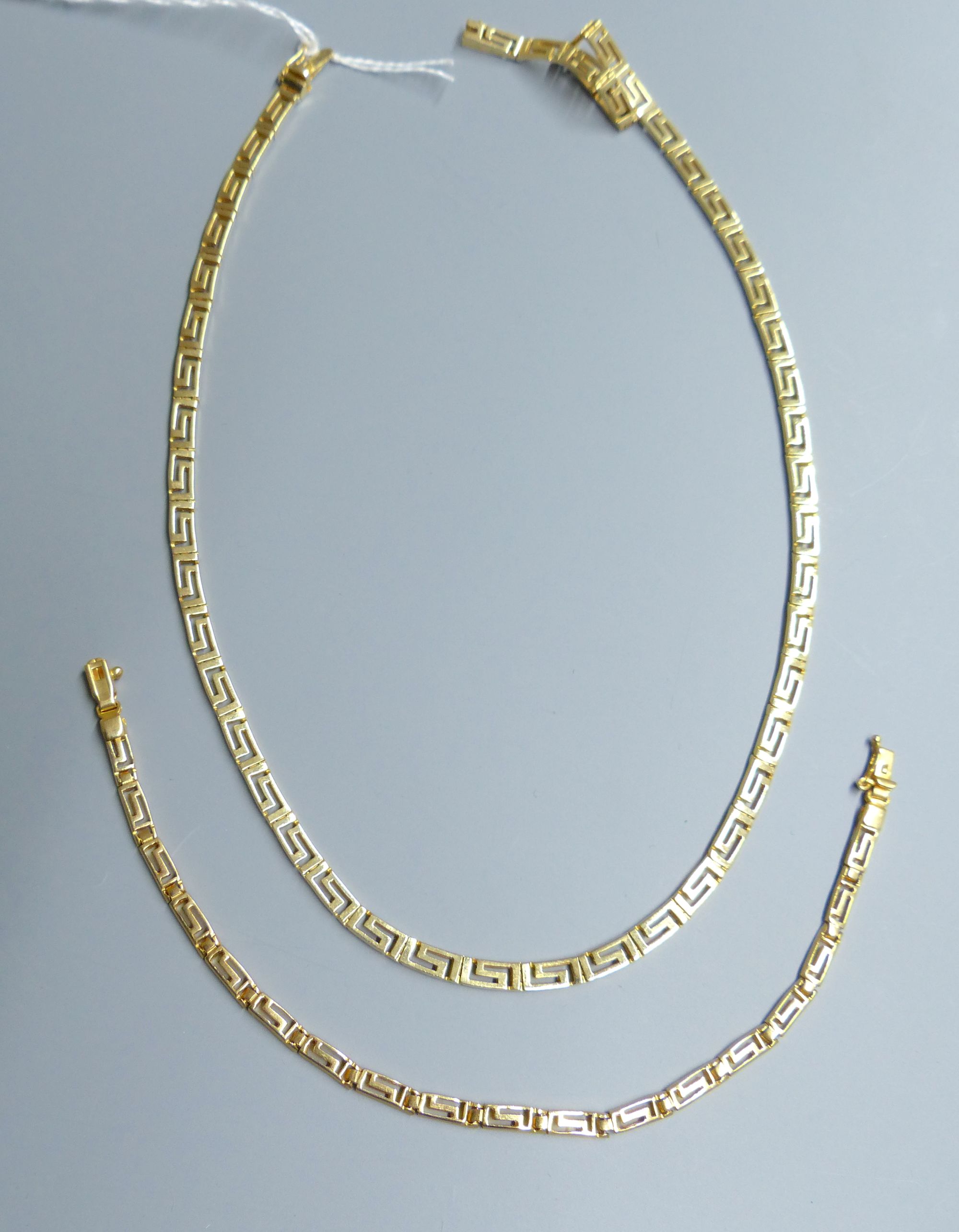 A modern 585 yellow metal Greek Key link necklace, approx. 42cm and matching bracelet, 18cm,